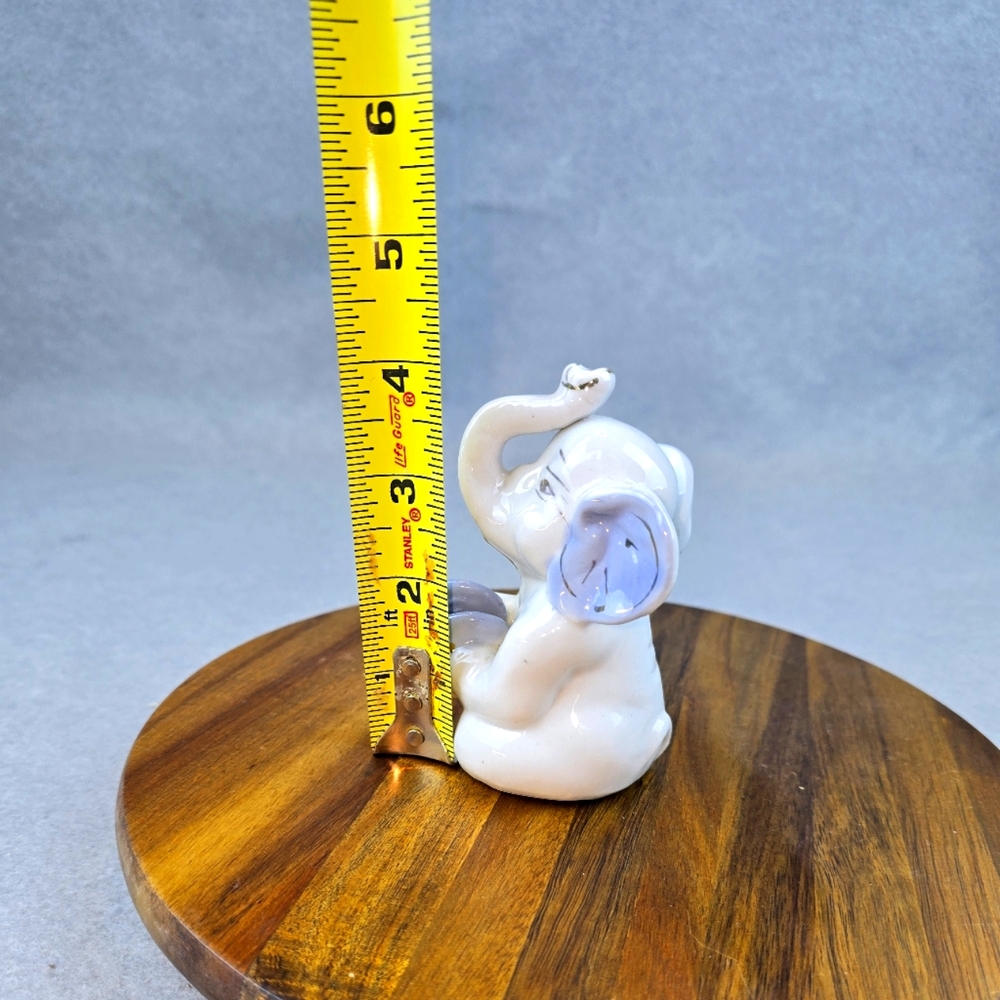4 vintage porcelain elephant figurines